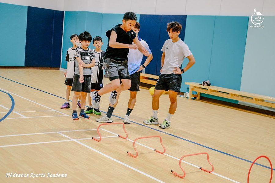 Children working through hurdle drills